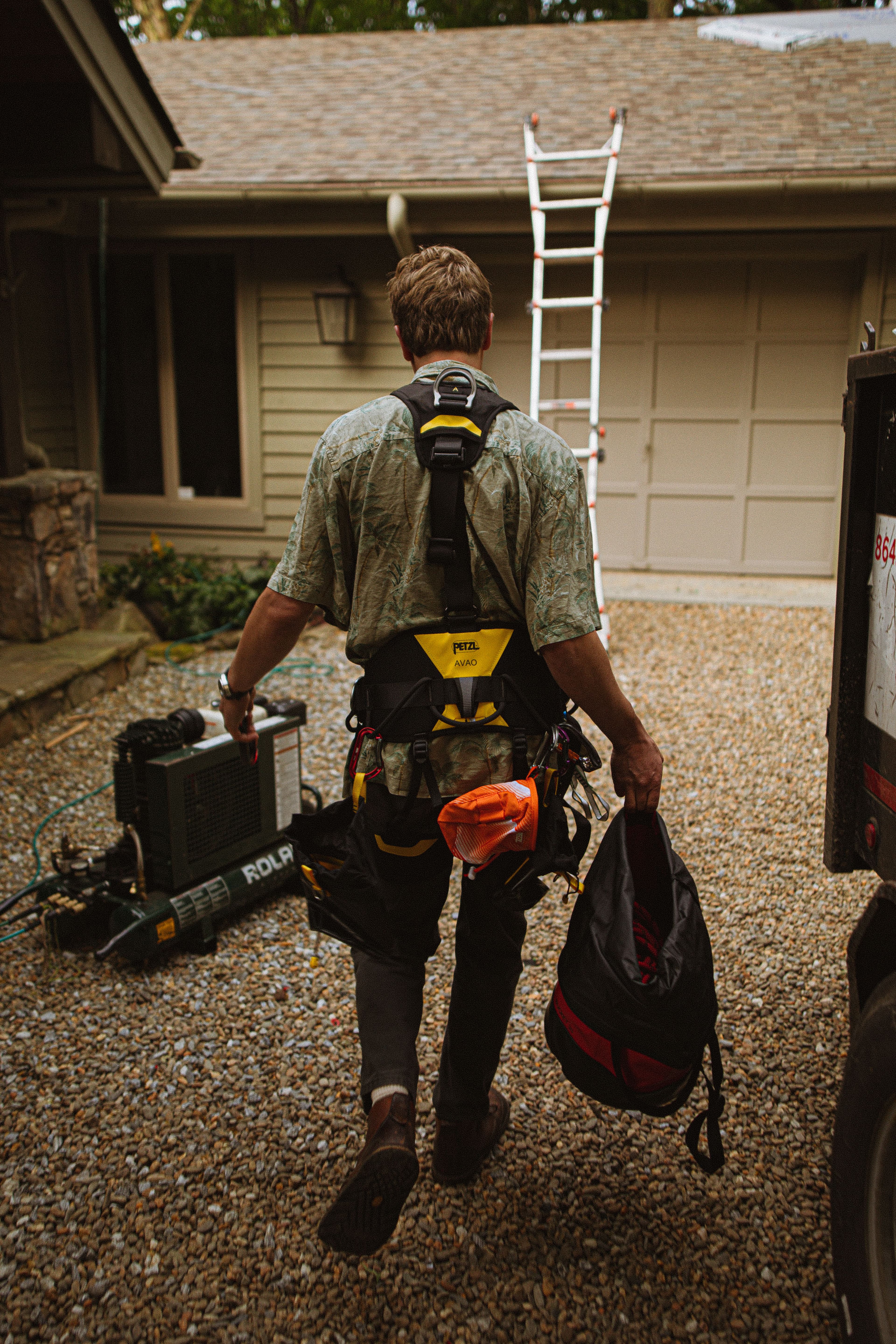 Roofer inspecting a roof to prepare an estimate